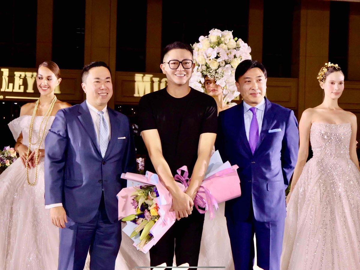 Mike Yutuc, fashion designer Michael Leyva and Kevin Tsang with models.